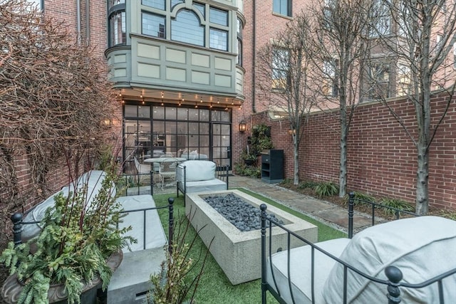 view of patio / terrace featuring an outdoor fire pit