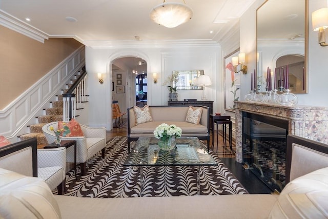 living room featuring hardwood / wood-style flooring and ornamental molding