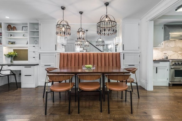 dining space with dark wood-type flooring and built in features