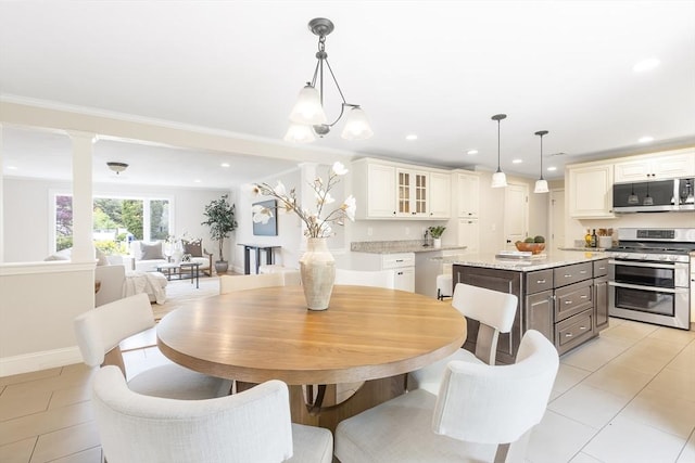 7 Langdon Rd, Natick, MA 01760 - dining area featuring light tile patterned floors, recessed lighting, baseboards, and ornate columns