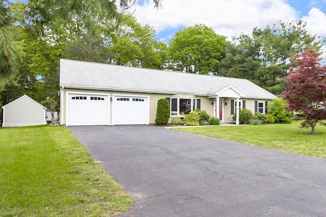 7 Langdon Rd, Natick, MA 01760 - ranch-style house featuring an attached garage, driveway, and a front yard
