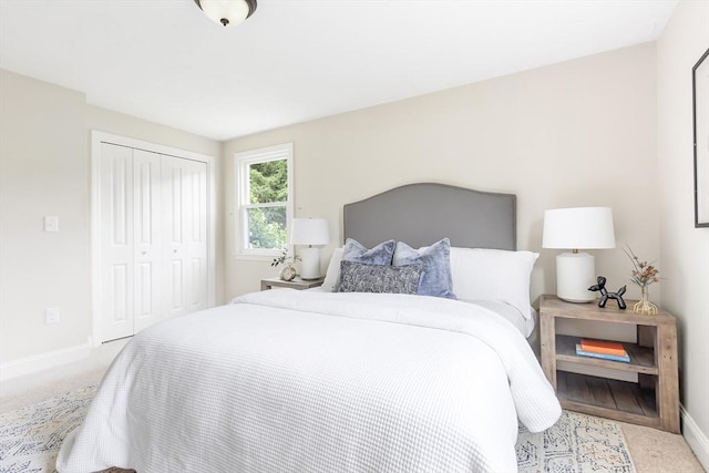 7 Langdon Rd, Natick, MA 01760 - bedroom with baseboards, a closet, and carpet
