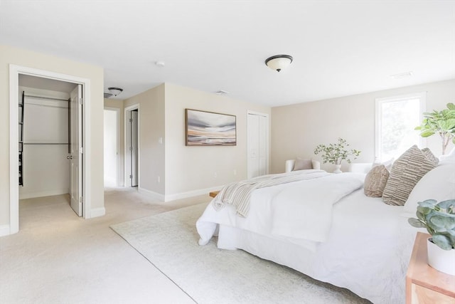 7 Langdon Rd, Natick, MA 01760 - bedroom with a closet, light carpet, and baseboards