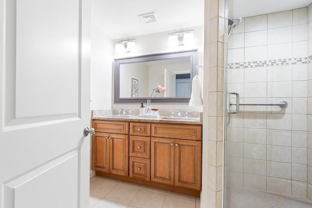 7 Langdon Rd, Natick, MA 01760 - bathroom with double vanity, a stall shower, and tile patterned floors