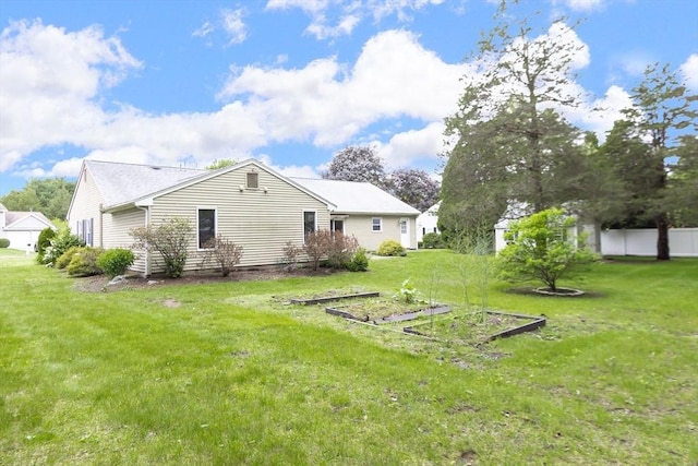 7 Langdon Rd, Natick, MA 01760 - back of property featuring a garden and a lawn