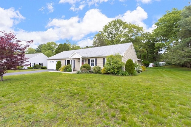 7 Langdon Rd, Natick, MA 01760 - ranch-style house featuring a garage, driveway, and a front lawn