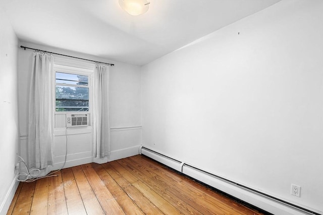 23 Turner St Unit 4, Salem, MA 01970 - empty room featuring baseboard heating, light wood-type flooring, and cooling unit