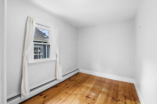 23 Turner St Unit 4, Salem, MA 01970 - unfurnished room with baseboard heating and wood-type flooring