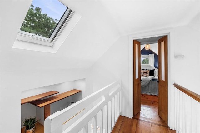 23 Turner St Unit 4, Salem, MA 01970 - corridor featuring hardwood / wood-style flooring, vaulted ceiling, a skylight, and a wainscoted wall