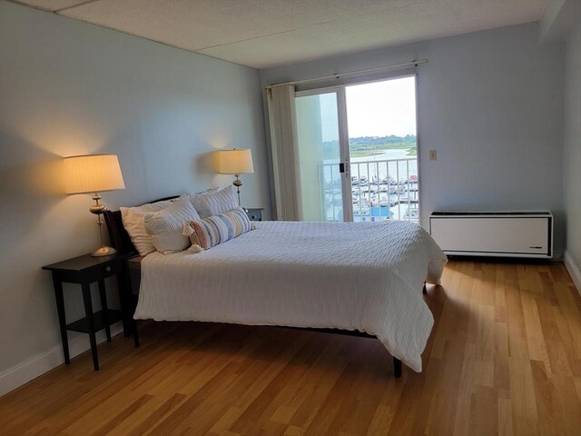 200 Cove Way Unit 607, Quincy, MA 02169 - bedroom featuring access to outside and wood finished floors