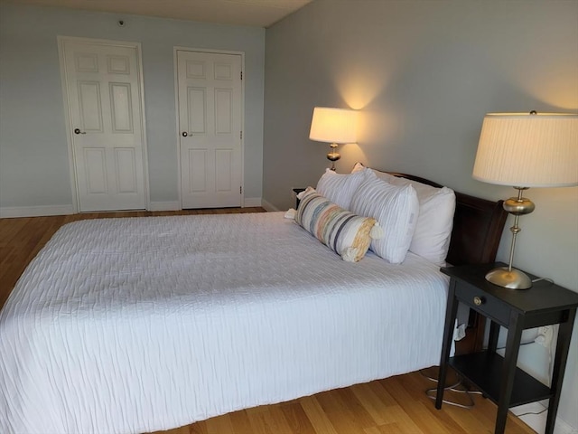 200 Cove Way Unit 607, Quincy, MA 02169 - bedroom with wood finished floors and baseboards