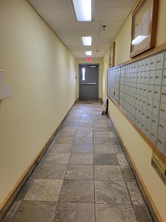 200 Cove Way Unit 607, Quincy, MA 02169 - hall featuring mail area, stone finish floors, and a drop ceiling