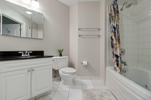 bathroom featuring tile patterned flooring, baseboards, toilet, shower / tub combo, and vanity