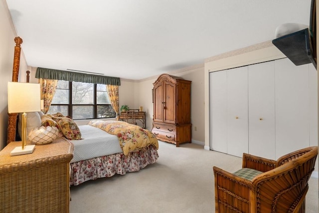 carpeted bedroom featuring a closet