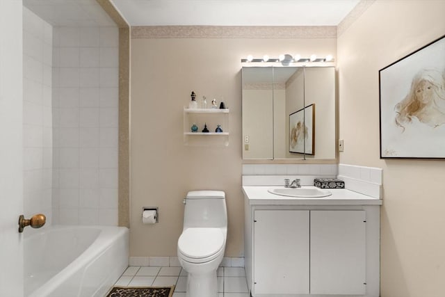 bathroom featuring toilet, vanity, tile patterned flooring, and a tub to relax in