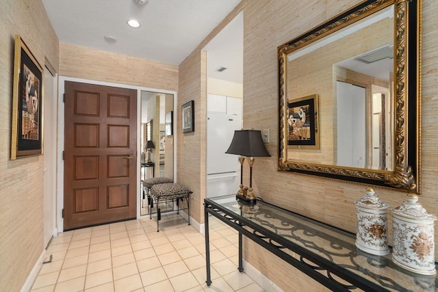 entryway featuring light tile patterned floors