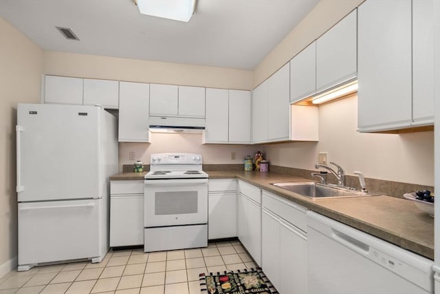 kitchen with white cabinetry, sink, white appliances, and light tile patterned floors