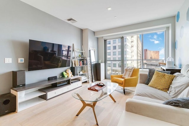 living room with light hardwood / wood-style flooring