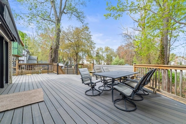 deck featuring outdoor dining area