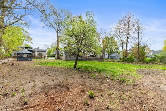 view of yard with a gazebo and fence