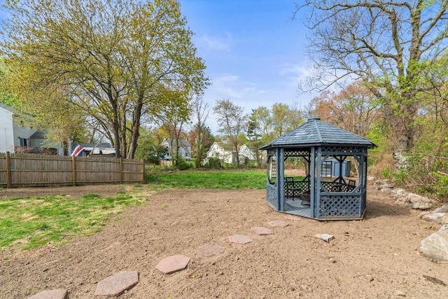 view of yard with a gazebo and fence