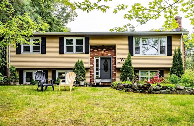 14 Mossman Rd, Westminster, MA 01473 - raised ranch with a front lawn and a chimney