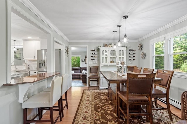 14 Mossman Rd, Westminster, MA 01473 - dining room with wood finished floors, ornamental molding, and a baseboard heating unit