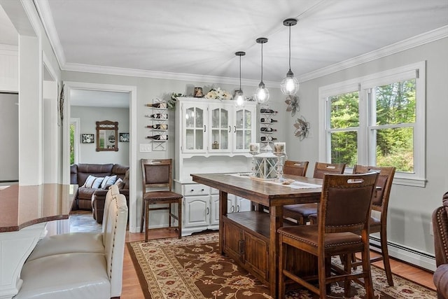 14 Mossman Rd, Westminster, MA 01473 - dining room featuring baseboard heating, wood finished floors, and ornamental molding