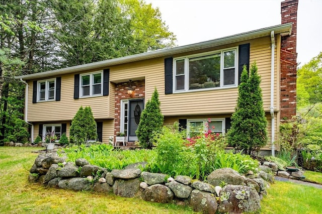 14 Mossman Rd, Westminster, MA 01473 - split foyer home featuring a chimney and a front yard