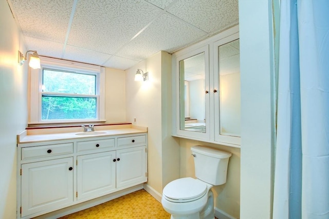 14 Mossman Rd, Westminster, MA 01473 - bathroom with a drop ceiling, toilet, vanity, and baseboards