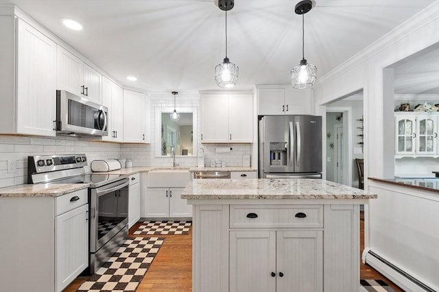 14 Mossman Rd, Westminster, MA 01473 - kitchen featuring stainless steel appliances, a baseboard radiator, a sink, white cabinetry, and ornamental molding