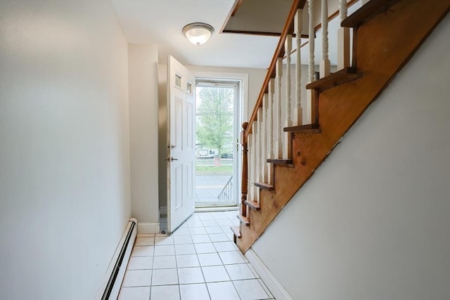 doorway to outside with a baseboard radiator, light tile patterned floors, baseboards, and stairs