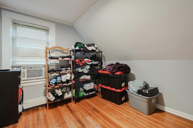 storage room featuring cooling unit and a baseboard radiator