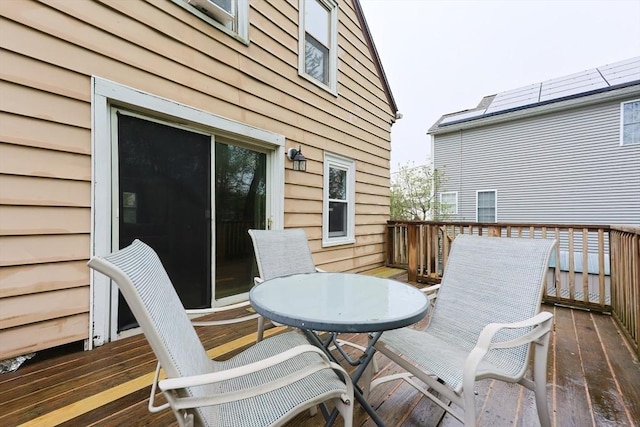 deck featuring outdoor dining area
