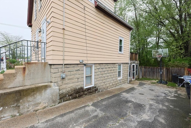view of home's exterior featuring fence