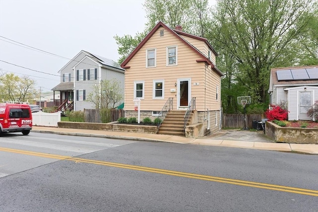 view of front of property with fence and entry steps