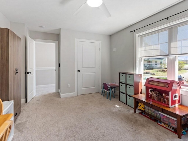 recreation room with carpet and ceiling fan