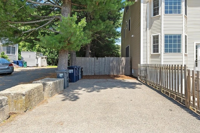 51 Loomis St Unit 51, Cambridge, MA 02138 - view of side of home with driveway and a storage unit