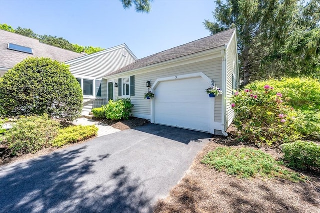 9 Longwood Rd Unit 239, Mashpee, MA 02649 - view of front facade with an attached garage and asphalt driveway
