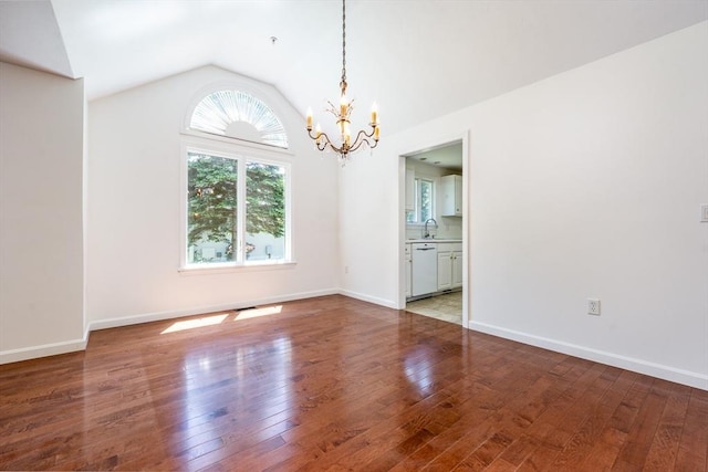 9 Longwood Rd Unit 239, Mashpee, MA 02649 - unfurnished room featuring a chandelier, wood-type flooring, vaulted ceiling, and baseboards