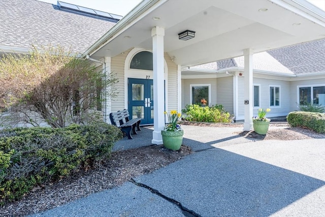 9 Longwood Rd Unit 239, Mashpee, MA 02649 - view of exterior entry with a shingled roof and a porch