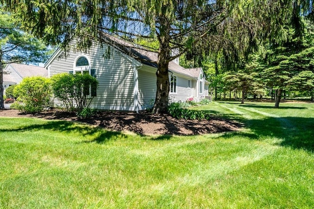 9 Longwood Rd Unit 239, Mashpee, MA 02649 - view of property exterior with a yard