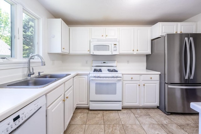 9 Longwood Rd Unit 239, Mashpee, MA 02649 - kitchen featuring white appliances, a sink, white cabinetry, and light countertops