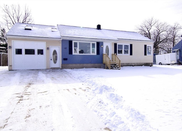 ranch-style home with a garage