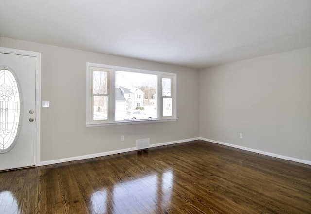 foyer entrance with dark wood-type flooring