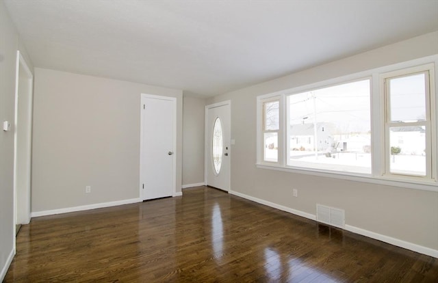 foyer with dark hardwood / wood-style floors