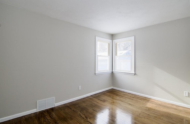 empty room featuring hardwood / wood-style flooring