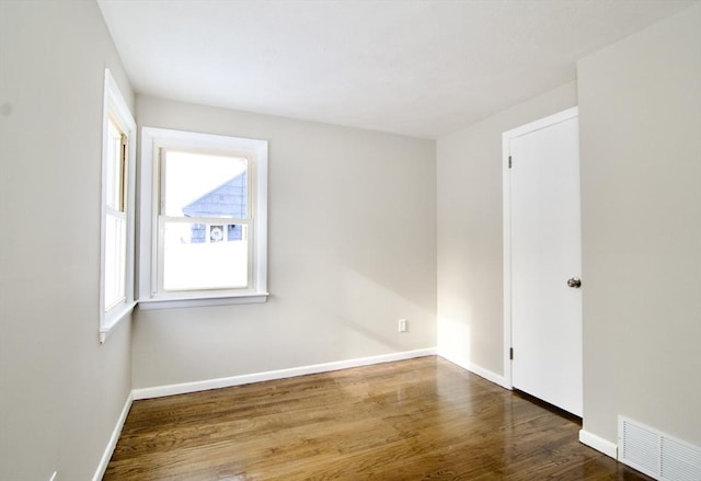 empty room featuring hardwood / wood-style flooring