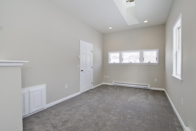 unfurnished room featuring a baseboard radiator and dark colored carpet