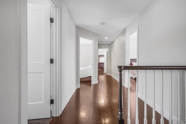 hall with dark hardwood / wood-style floors